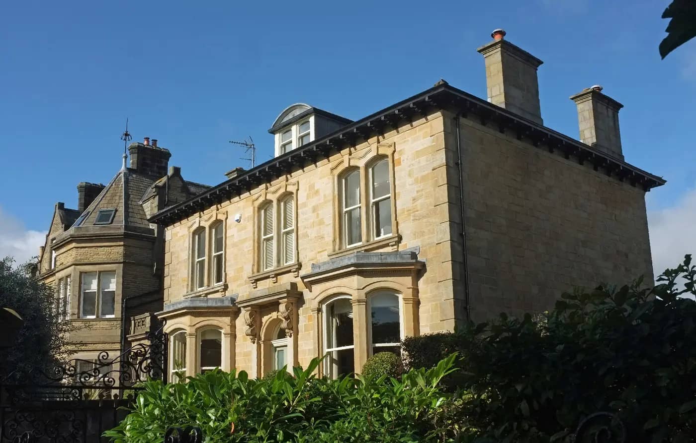 Victorian stone villas on York Place, Harrogate, under a blue sky