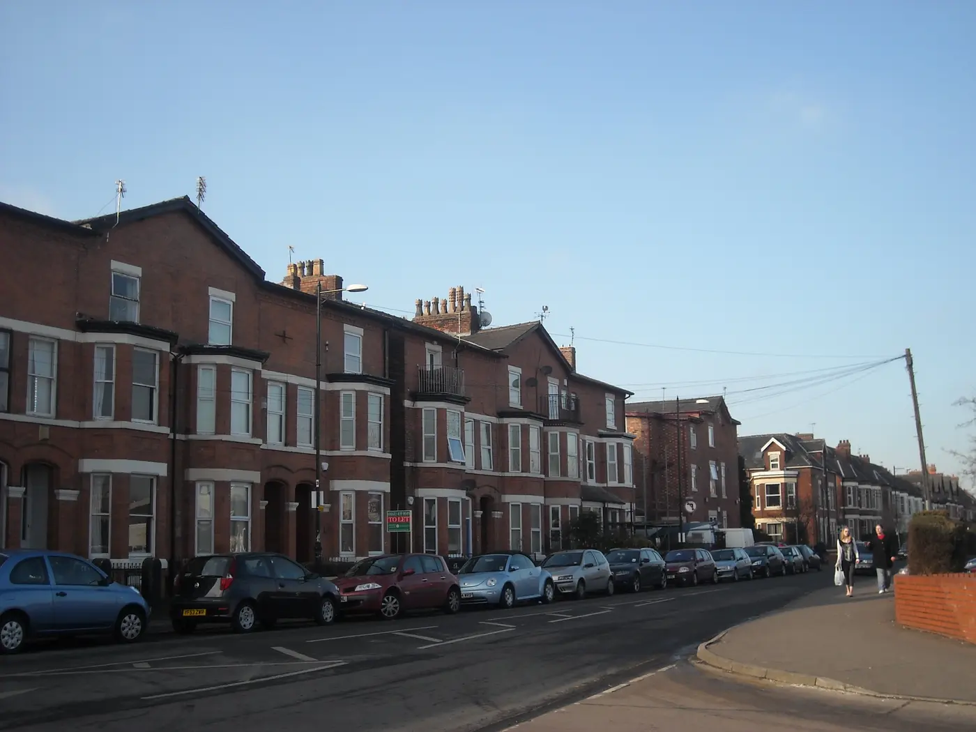 Bay-fronted Victorian red-brick houses along Albany Road in Chorlton, Manchester