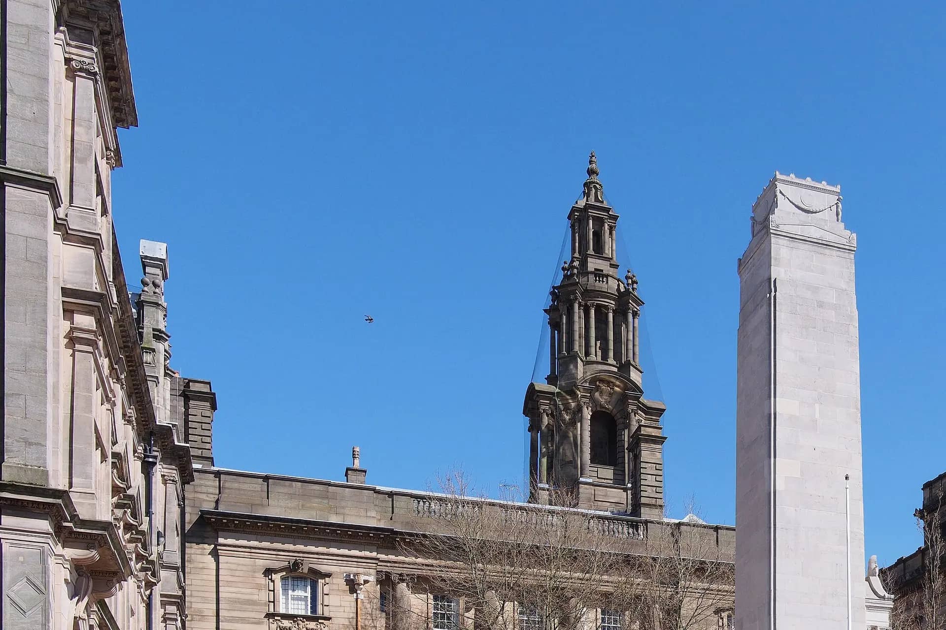 Preston's Flag Market with the Cenotaph, the Harris Museum and the Sessions House tower under a blue sky