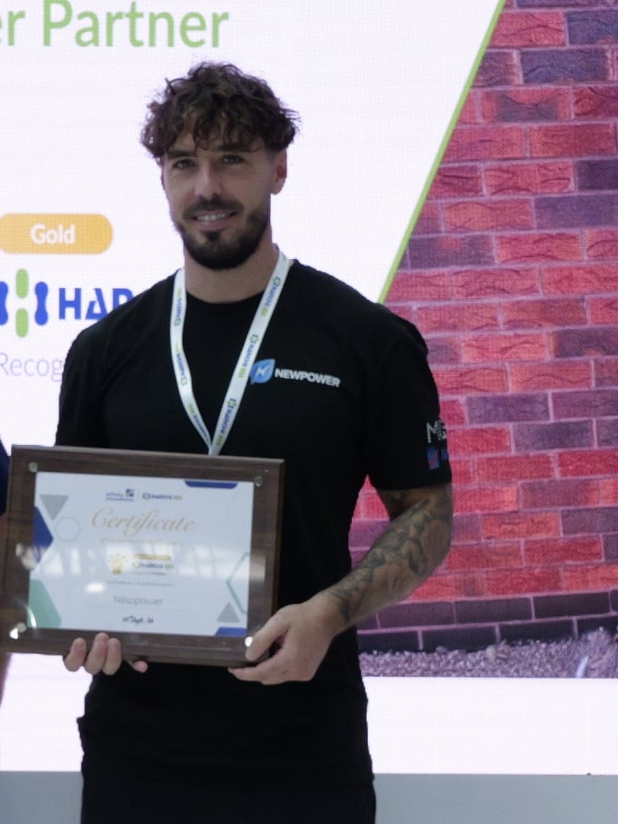 Joe Sales, owner of Newpower, holding the company's Hanchu ESS installer partner certificate