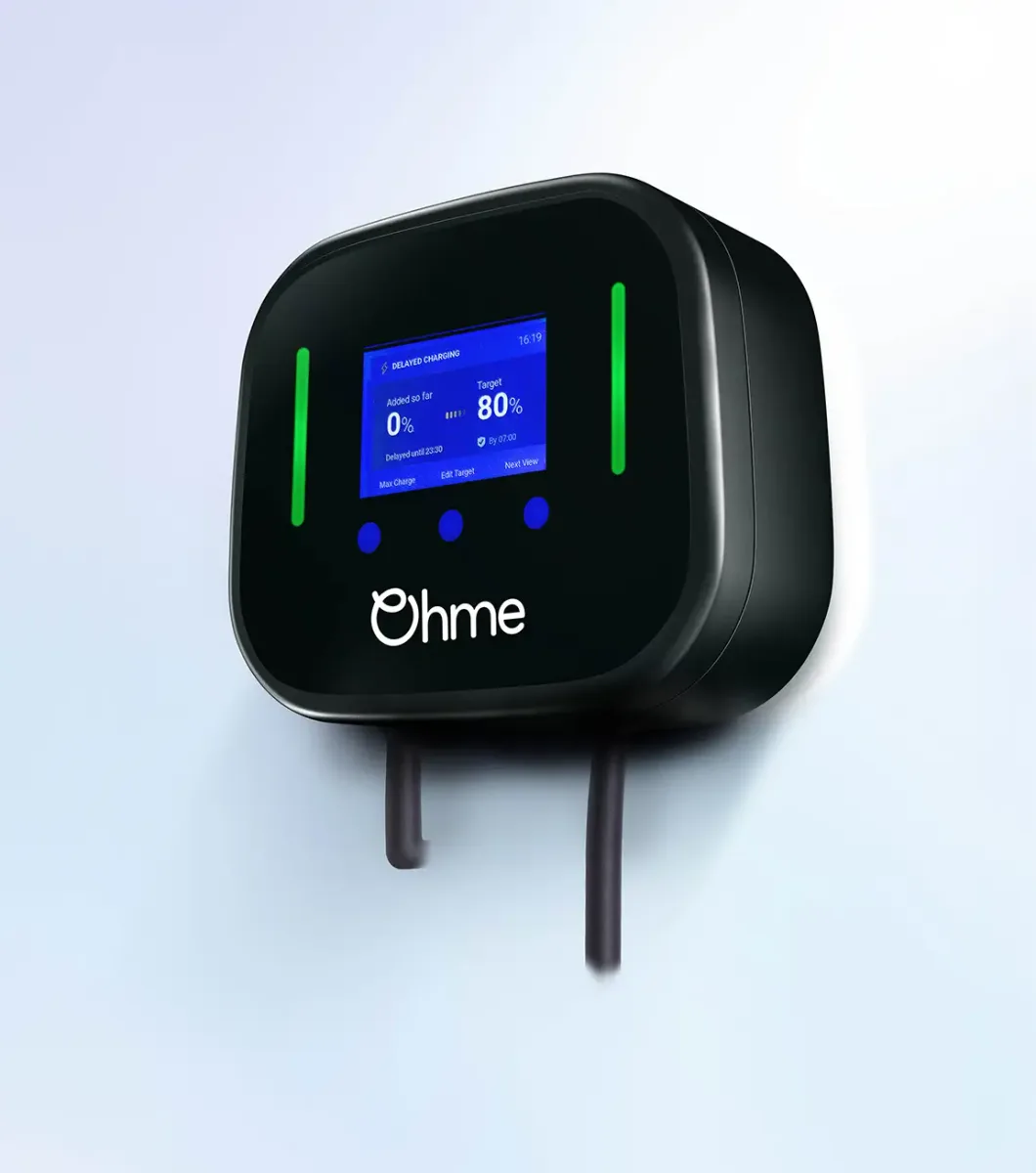 Ohme Home Pro tethered EV charger with its cable, screen lit